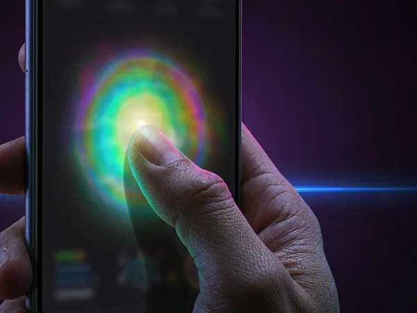 as8 finger touching a glowing circle on a phone screen