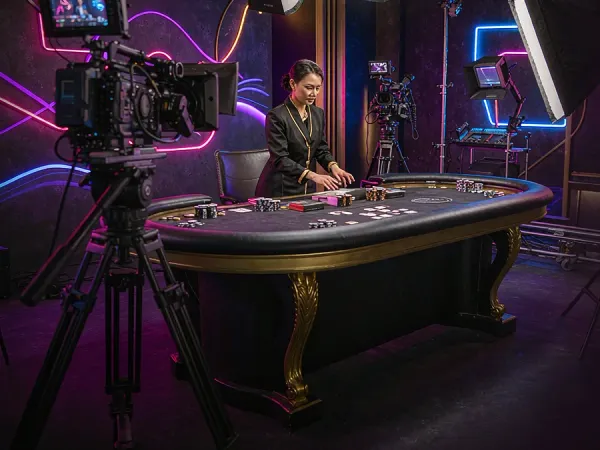 as8 camera and studio lighting facing a casino table